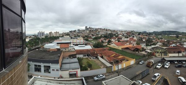 Buildings against cloudy sky