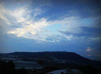 View of mountain range against cloudy sky