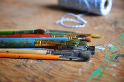 High angle view of paintbrushes on table