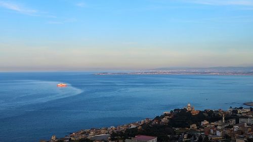 Scenic view of sea against blue sky