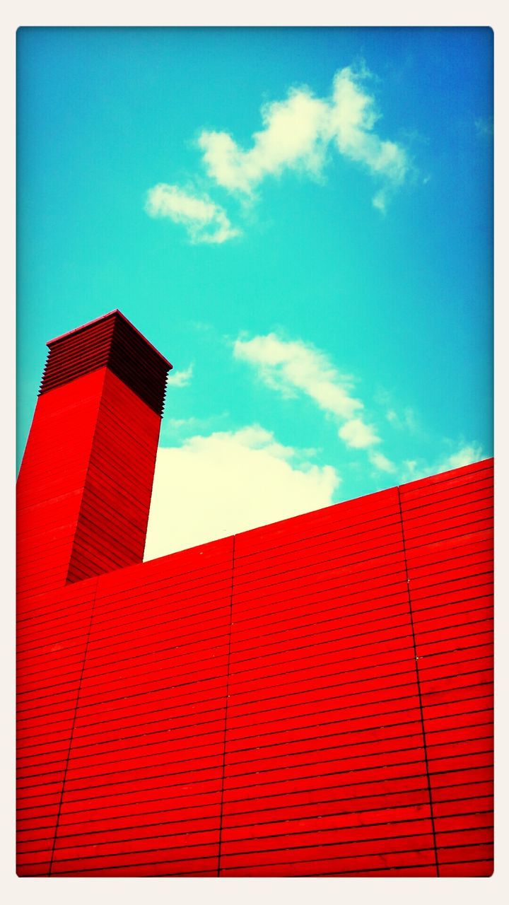 transfer print, low angle view, building exterior, architecture, built structure, sky, blue, auto post production filter, red, cloud, cloud - sky, roof, high section, day, outdoors, no people, house, flag, sunlight, residential structure