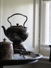 Close-up of lamp on table at home