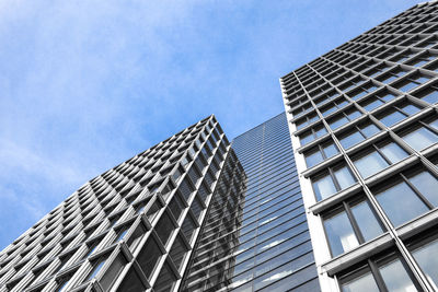 Low angle view of modern buildings against sky