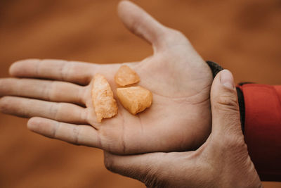 Close-up of man holding ice cream
