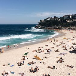 High angle view of people on beach during sunny day