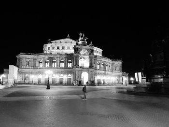Statue in town square at night
