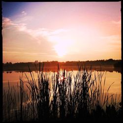 Scenic view of lake during sunset