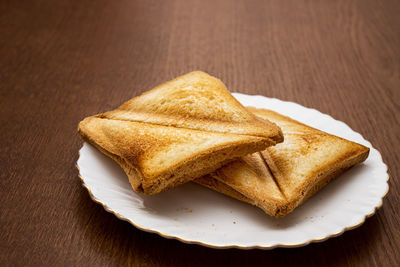 Close-up of bread in plate on table