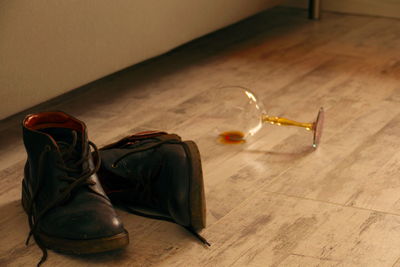 Shoes and wine glass after a hard day