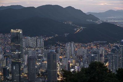 High angle view of illuminated buildings in city against sky