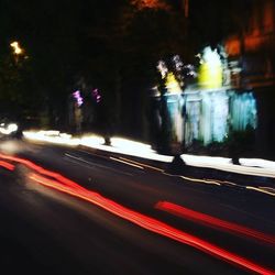 Blurred motion of car moving on road at night