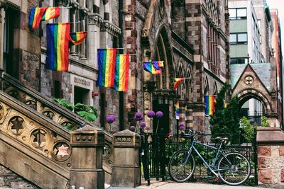 Rainbow flags on hanging on buildings in city