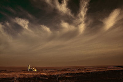 Scenic view of sea against cloudy sky