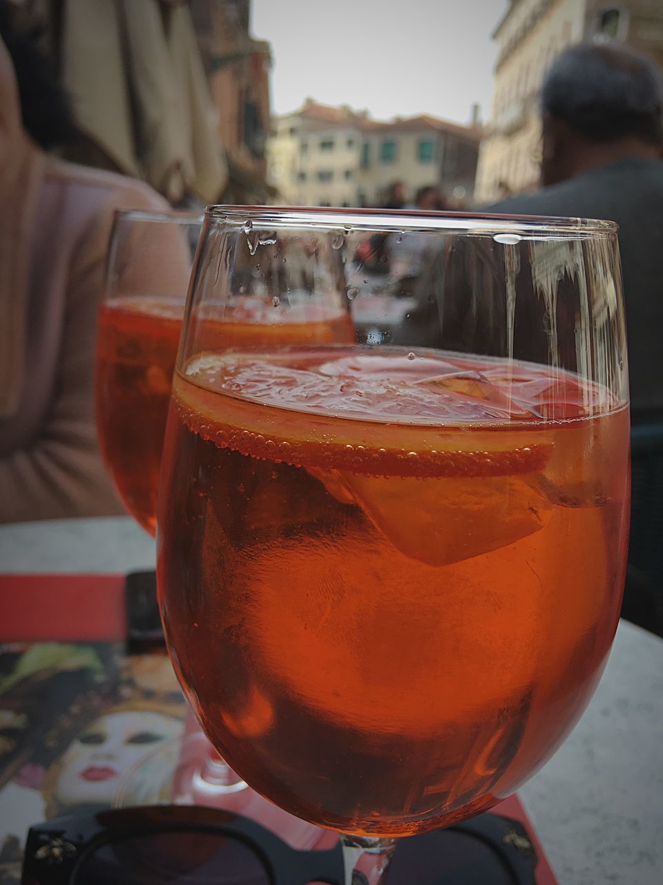 CLOSE-UP OF DRINK IN GLASS ON TABLE