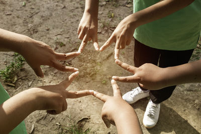 Low section of man holding hands