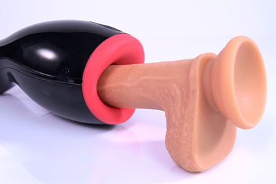 Close-up of toy on table against white background