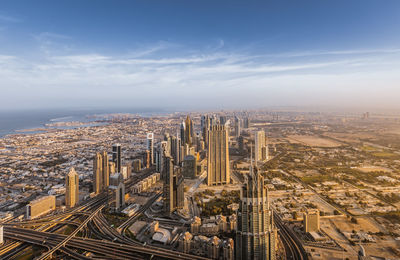 High angle view of city buildings against sky