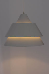 Low angle view of illuminated electric lamp