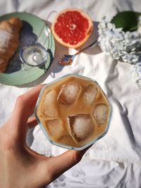 Close-up of hand holding drink