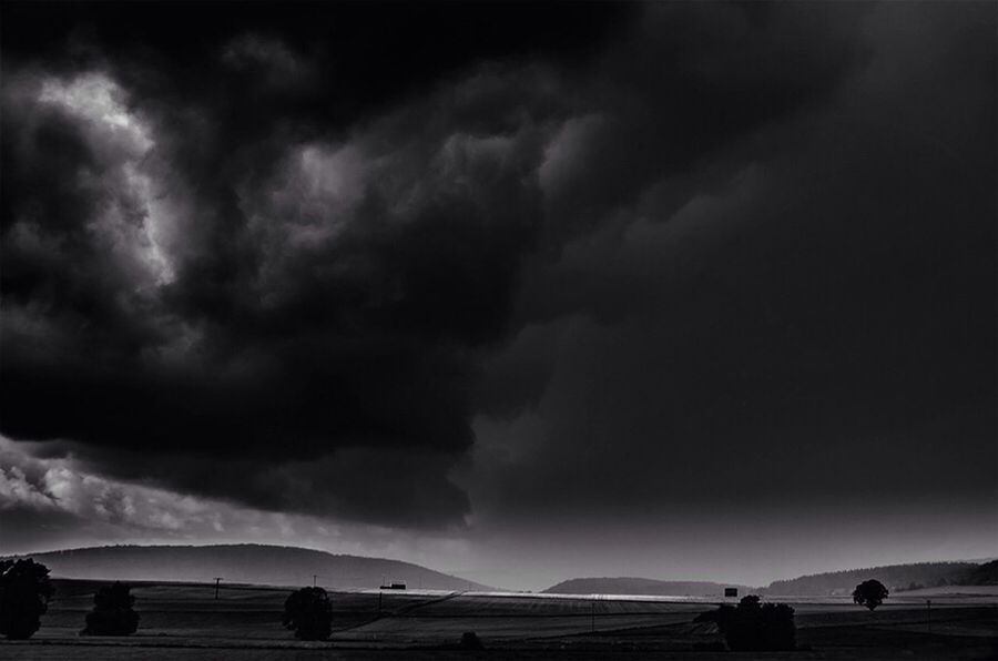 sky, cloud - sky, cloudy, weather, scenics, beauty in nature, overcast, tranquil scene, tranquility, storm cloud, nature, transportation, cloud, cloudscape, dusk, silhouette, dramatic sky, mode of transport, outdoors, landscape