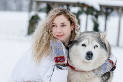 Portrait of young woman with dog