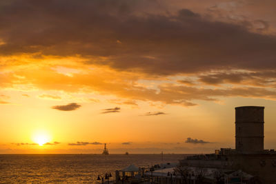 Scenic view of sea at sunset