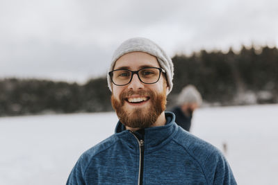 Happy man looking at camera