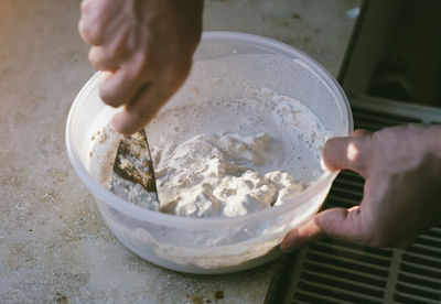 Midsection of woman holding ice cream in bowl