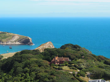 Scenic view of sea and buildings against sky