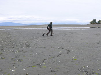 Woman standing on beach