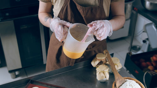 Midsection of woman preparing food