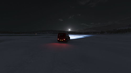 Car on road at night during winter