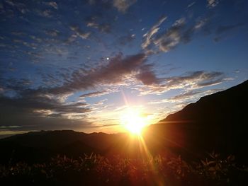 Sun shining through clouds