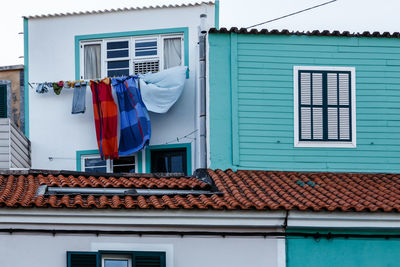 Clothes drying outside house