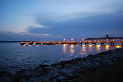 View of bridge over sea at sunset