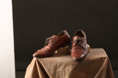Low section of man wearing shoes