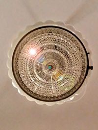 Close-up of circular object on wall