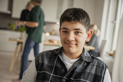 Portrait of teenage boy at home