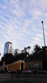 Low angle view of building against cloudy sky