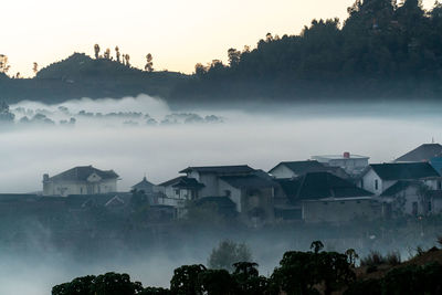 Fog enveloped residents in the dieng plateau, in central java.