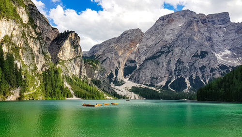 Scenic view of lake and mountains against sky