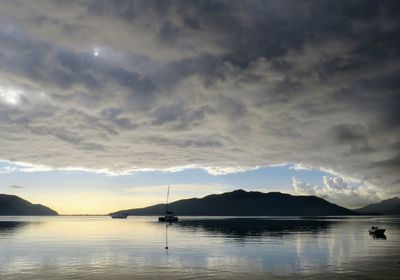 Scenic view of lake against sky during sunset