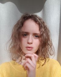 Close-up portrait of young woman with brown hair