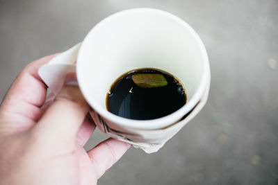 Close-up of hand holding ice cream