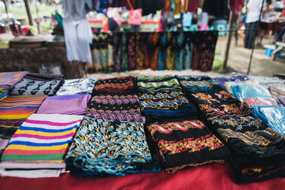 Close-up of multi colored fabrics for sale in market