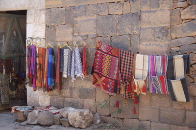 Clothes drying against wall in building