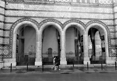Man in front of building