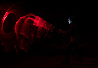 People in illuminated nightclub at night