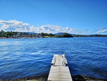 Scenic view of lake against blue sky