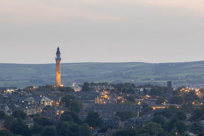 High angle view of illuminated buildings in city against sky